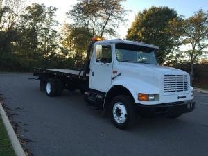 1996 INTERNATIONAL 4700 ROLLBACK 19 FOOT CHAMPION STEEL BED DIESEL NAVISTAR